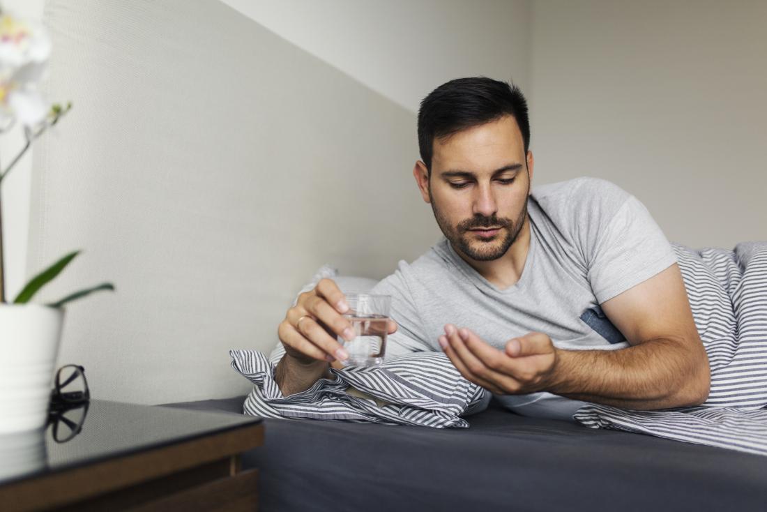 man taking zzzquil at night wondering about side effects